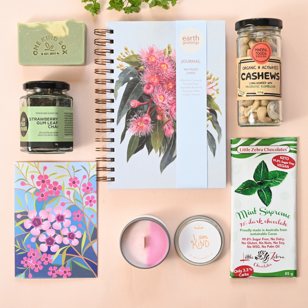 Self-Care Gift Hamper, Just Because Gift Hamper, Eco Gift Hamper by One Kind Box. Includes a lined journal and an affirmation candle plus many small-batch made products the gift recipient will love.