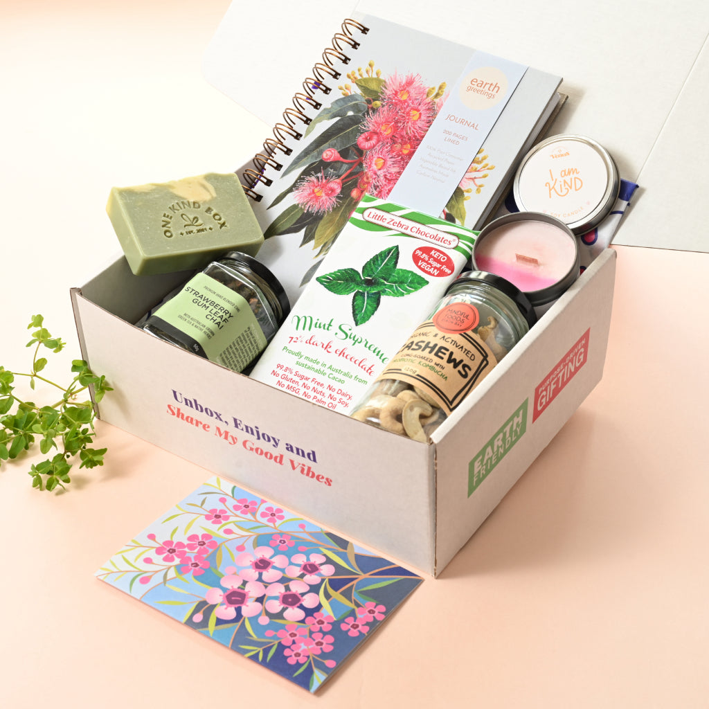 Self-Care Gift Hamper, Just Because Gift Hamper, Eco Gift Hamper by One Kind Box. Includes a lined journal and an affirmation candle plus many small-batch made products the gift recipient will love.